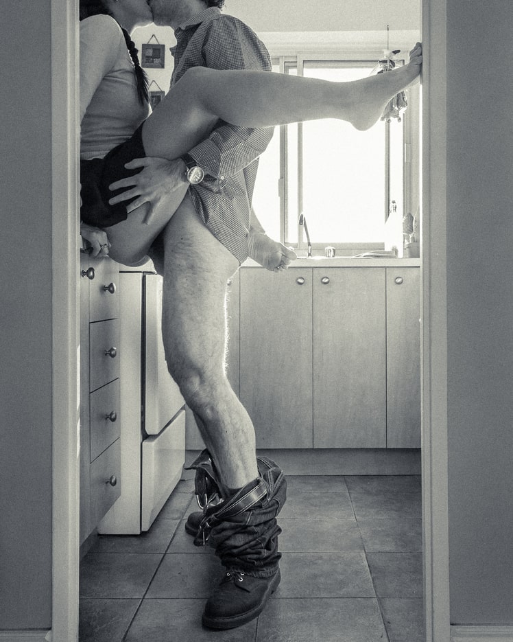 Couple having sex on the kitchen counter